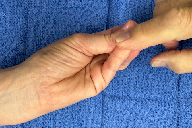 Testing little finger opposition.